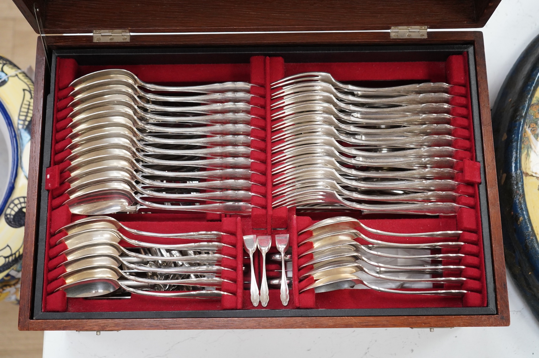 An oak cased, near complete, comprehensive canteen of plated cutlery together with odd cutlery from other sets.